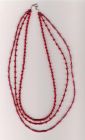 Three stranded red necklace.