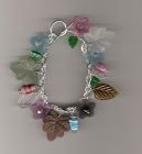 Multi-coloured lucite flower and leaf charm style brace let.