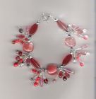 Red bead cluster charm style bracelet.