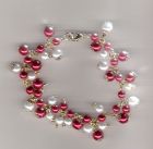 Red and white charm style bracelet.