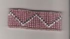 Pink and silver coloured beaded cuff.