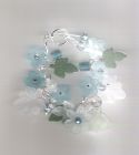 SOLD. Turquoise lucite flower charm style bracelet.